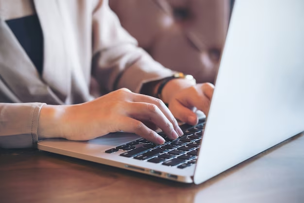 Person typing on a laptop