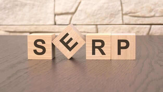 Wooden blocks spelling 'SERP'