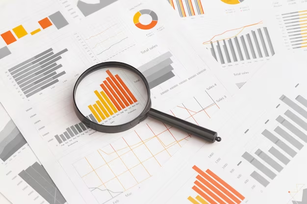 Papers with data and magnifying glass on top